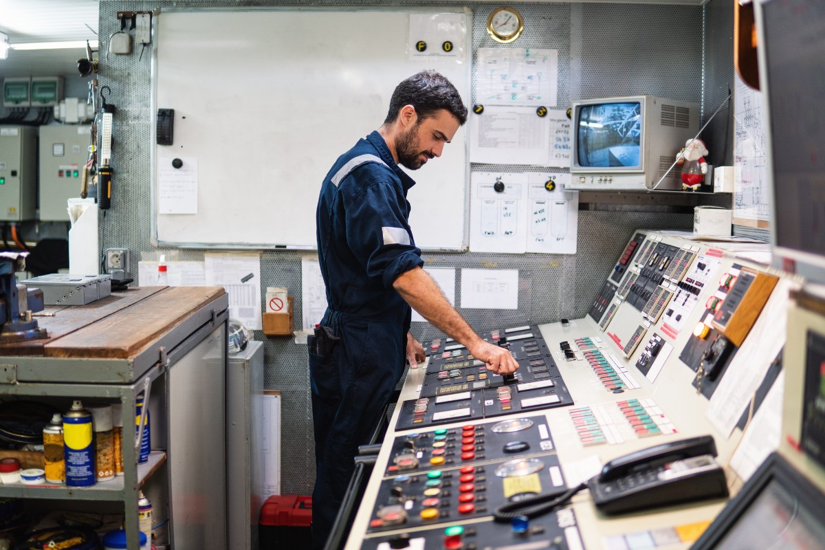 Marine engineer in control room of ship